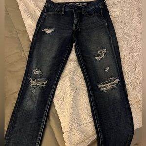 American Eagle woman’s 360 degree stretch. Dark wash with embellished rips